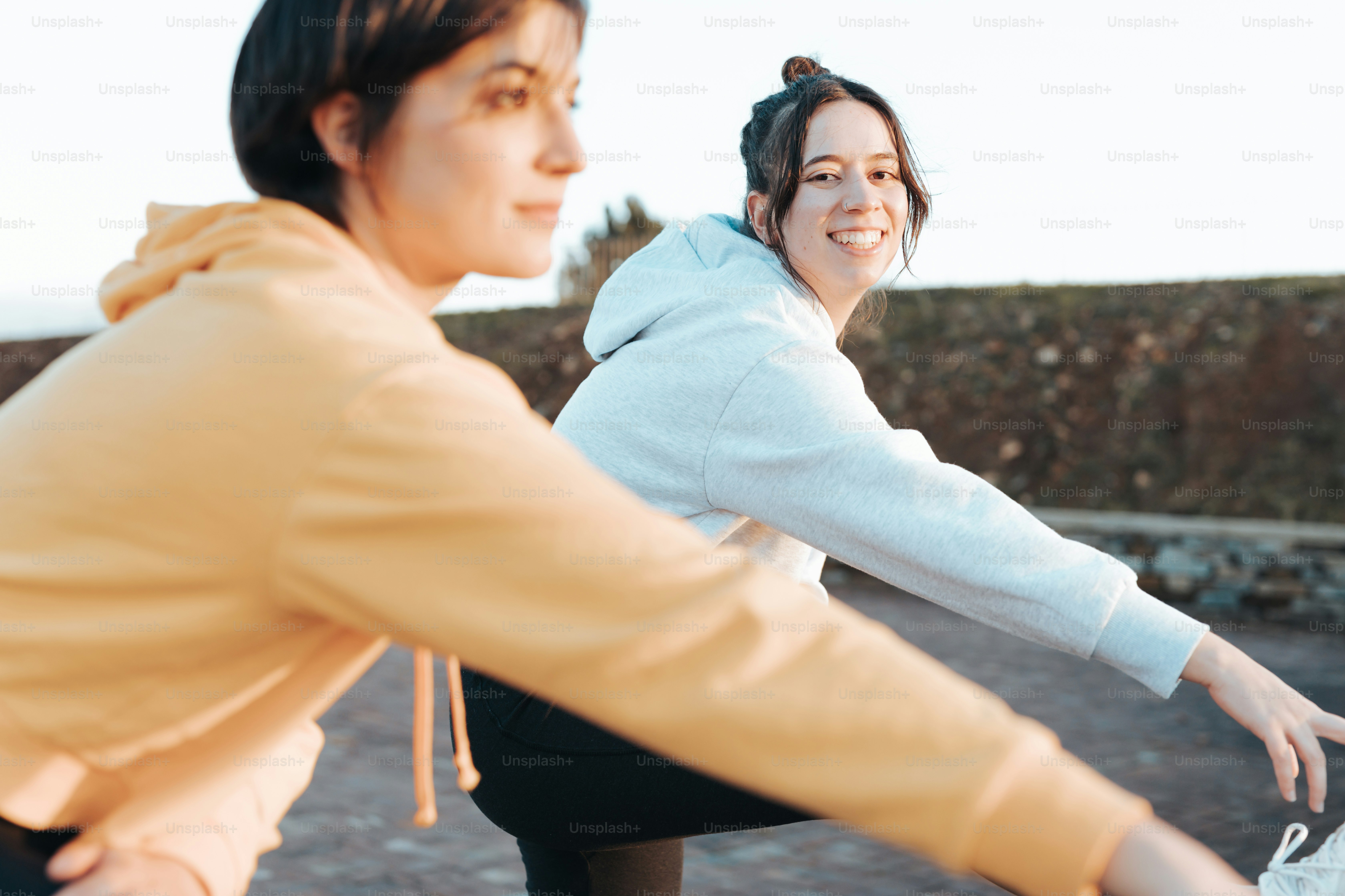 a couple of women riding on top of a bike