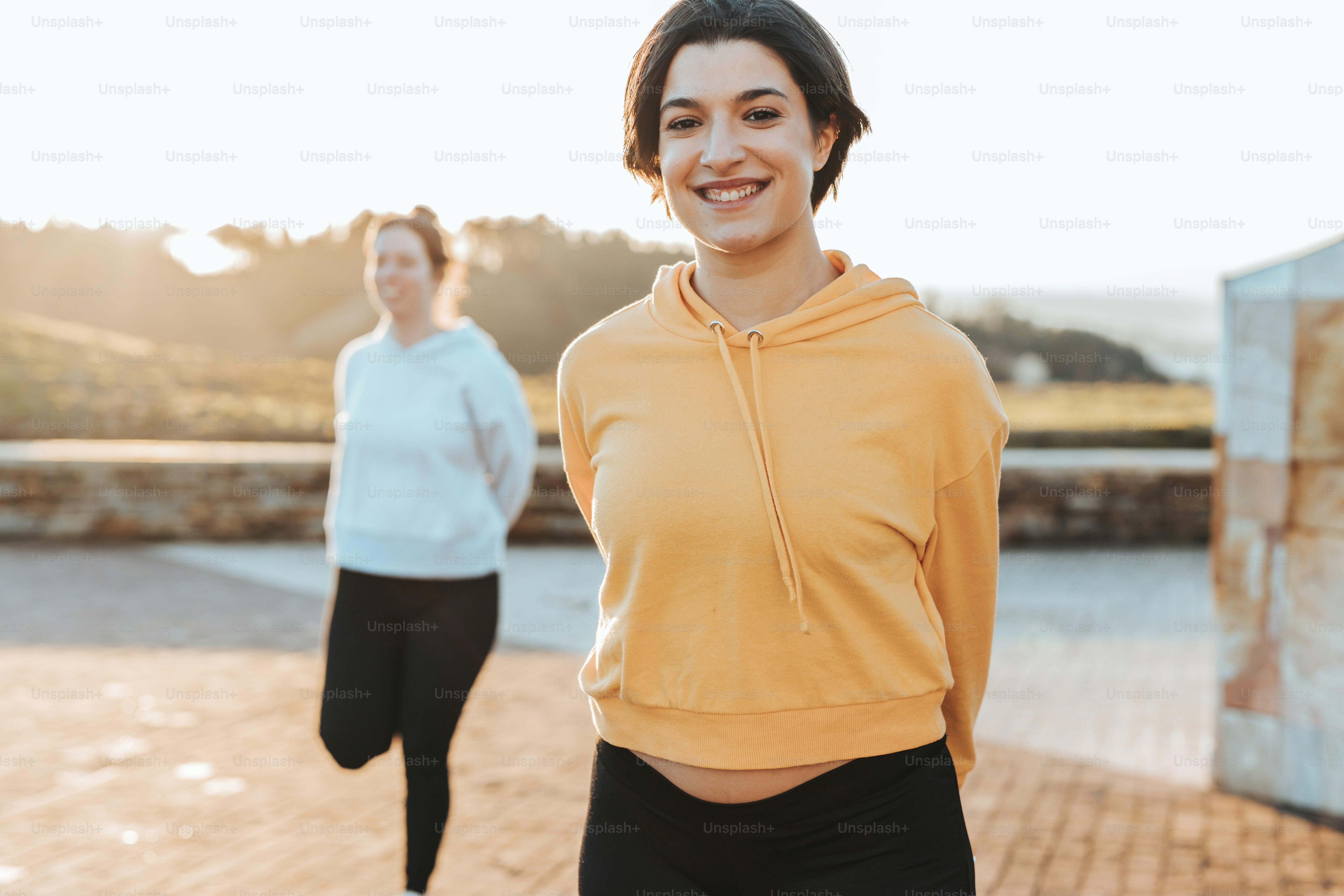 a couple of women standing next to each other