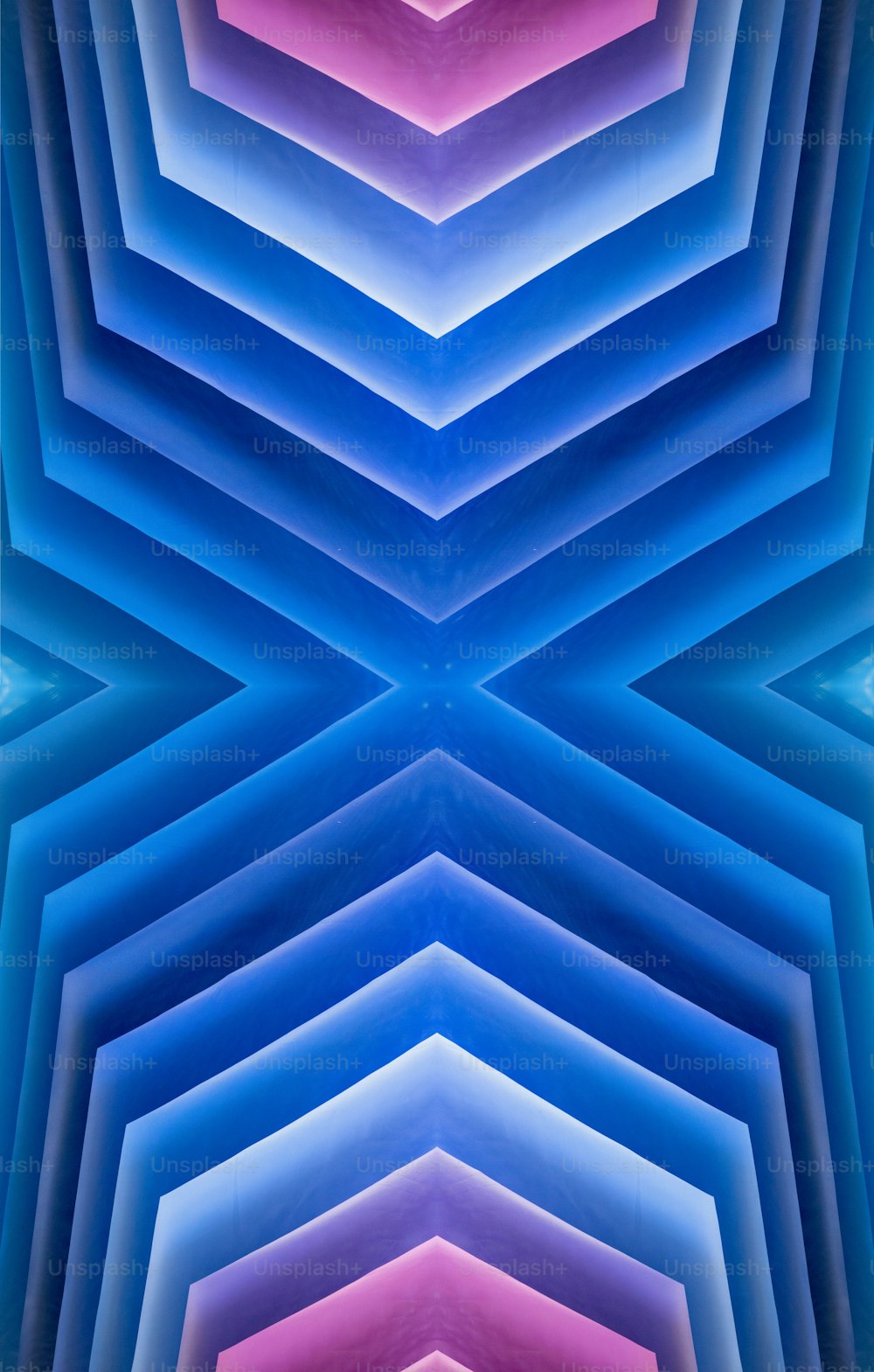 an abstract image of blue, pink, and purple shapes