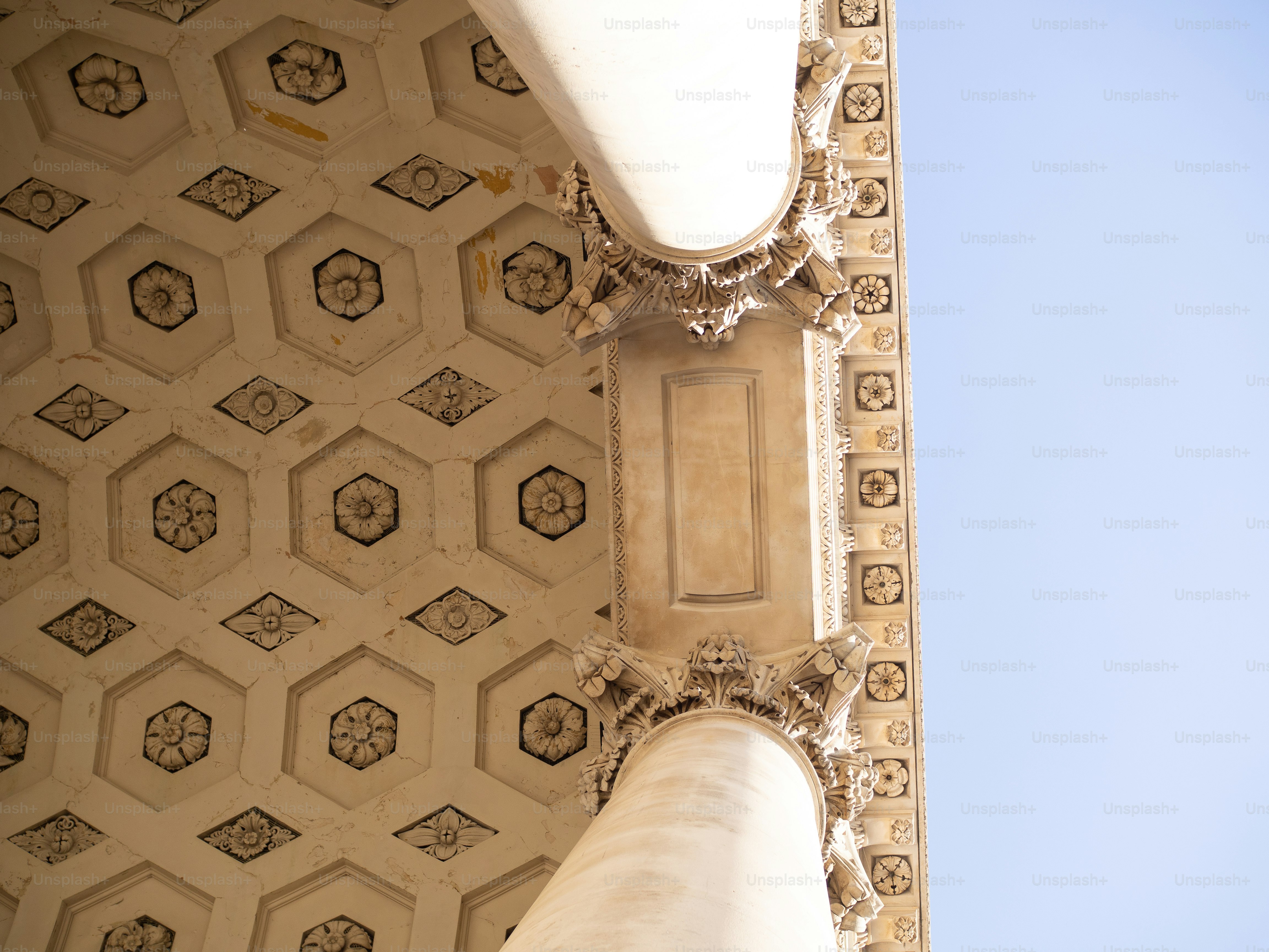 a close up of a building with a sky in the background