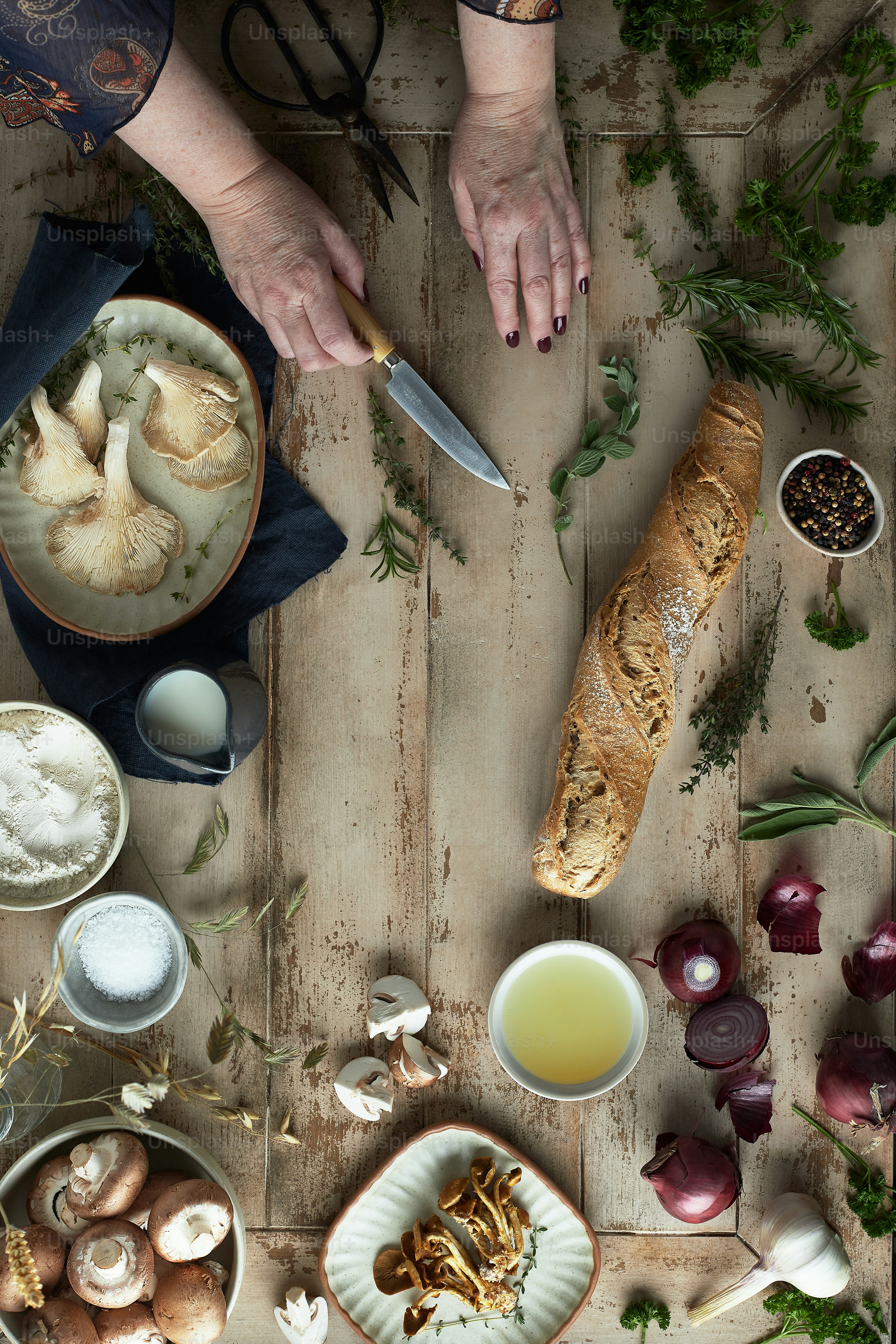 a table topped with bowls of food and a knife