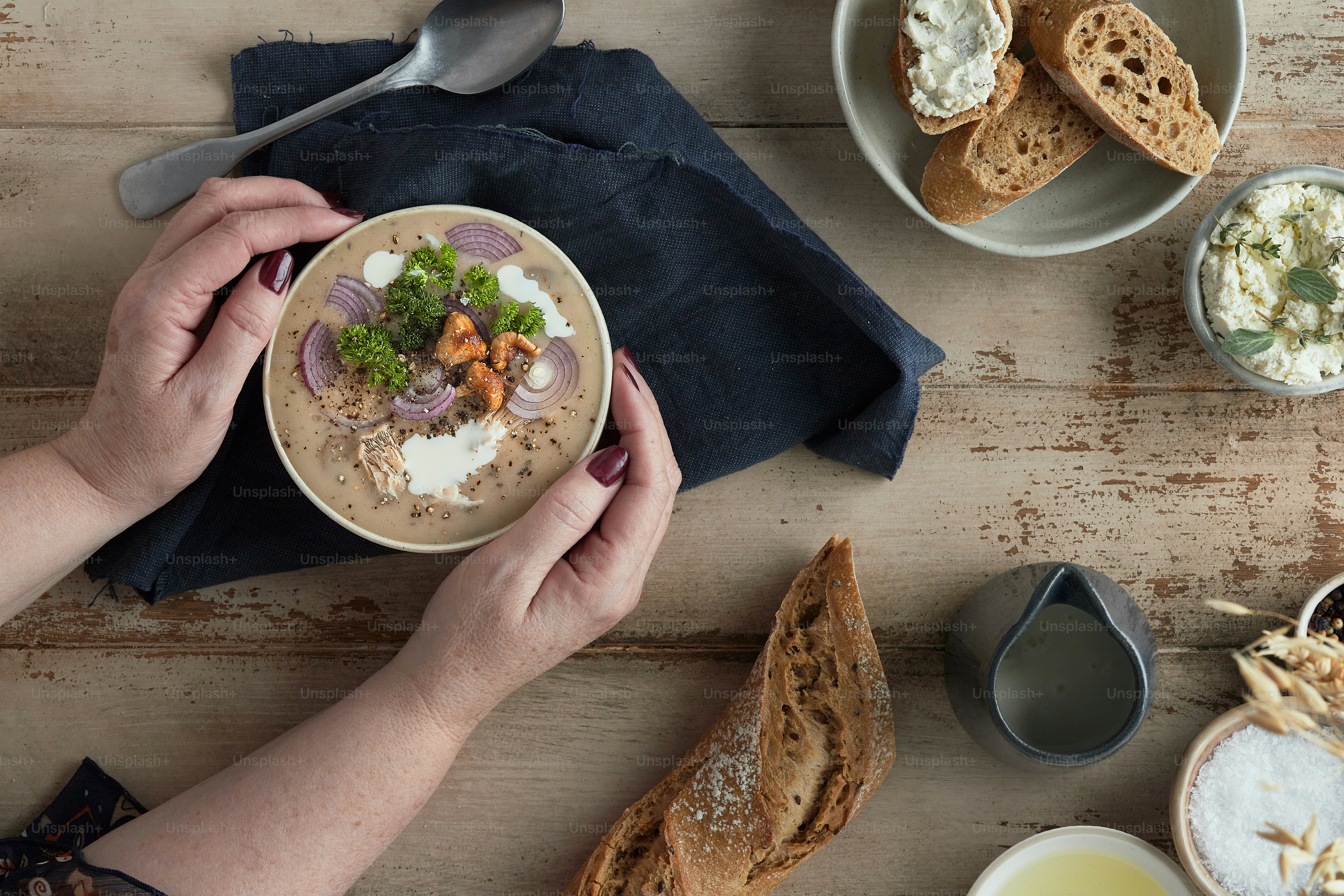 a person is holding a bowl of food