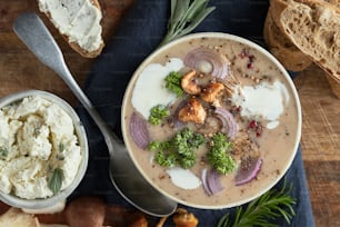 a bowl of soup with a spoon next to it