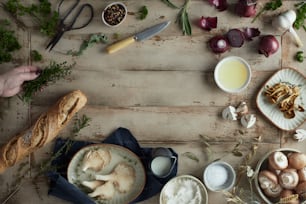 a wooden table topped with bowls of food