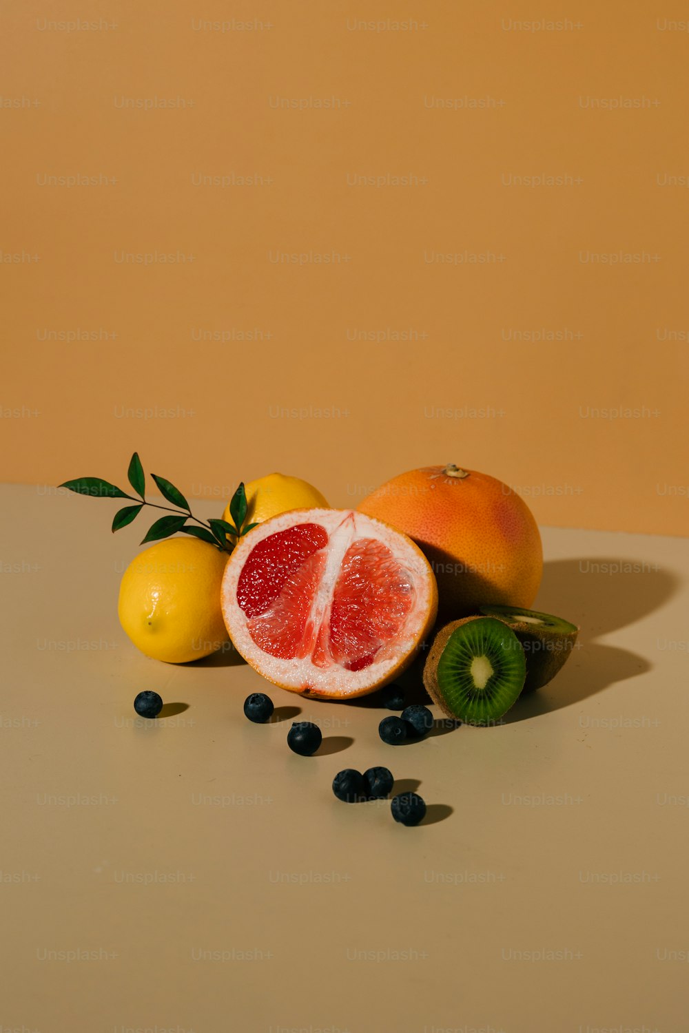 a pile of fruit sitting on top of a table