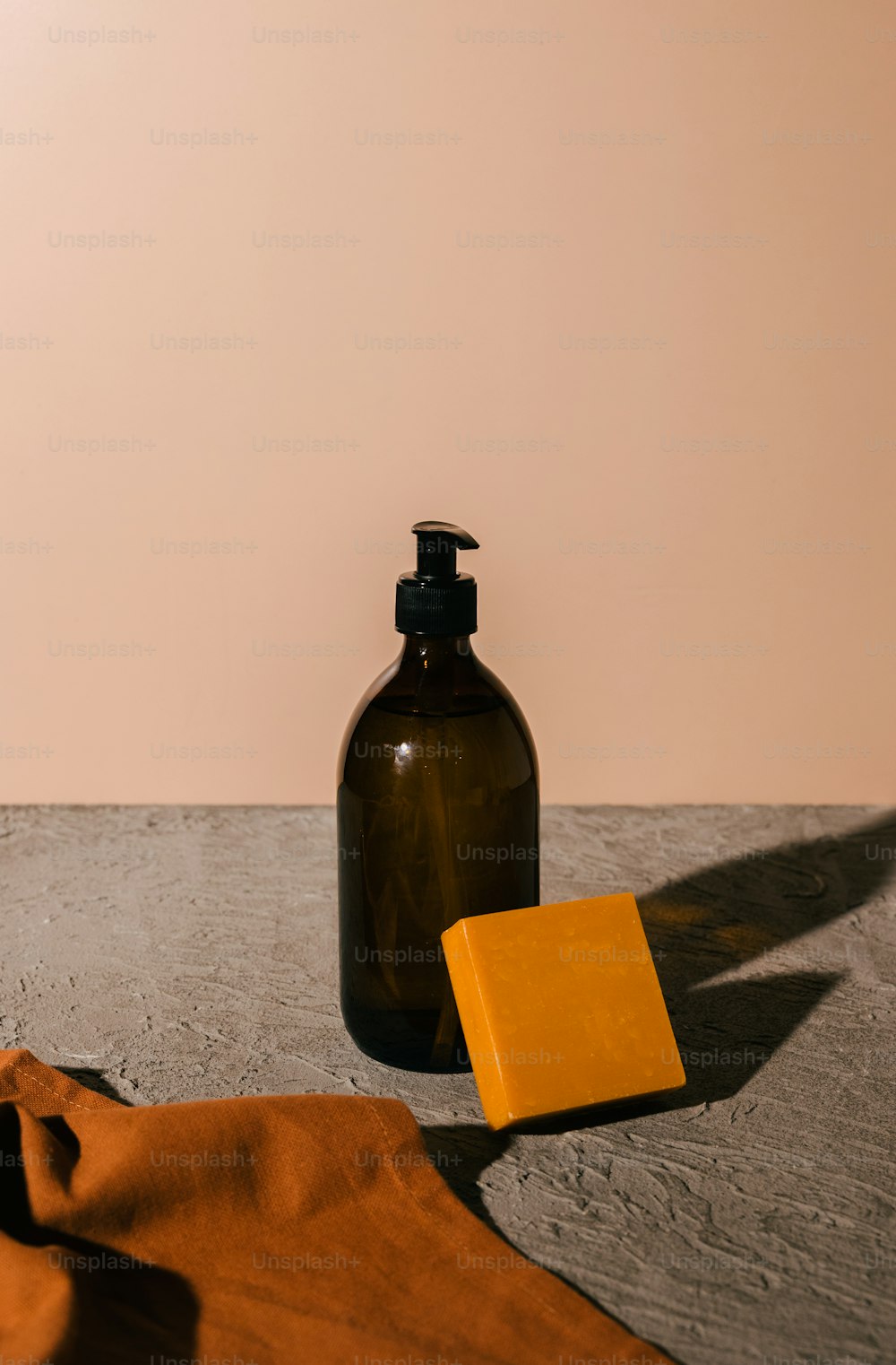 a bottle of soap next to a soap dish