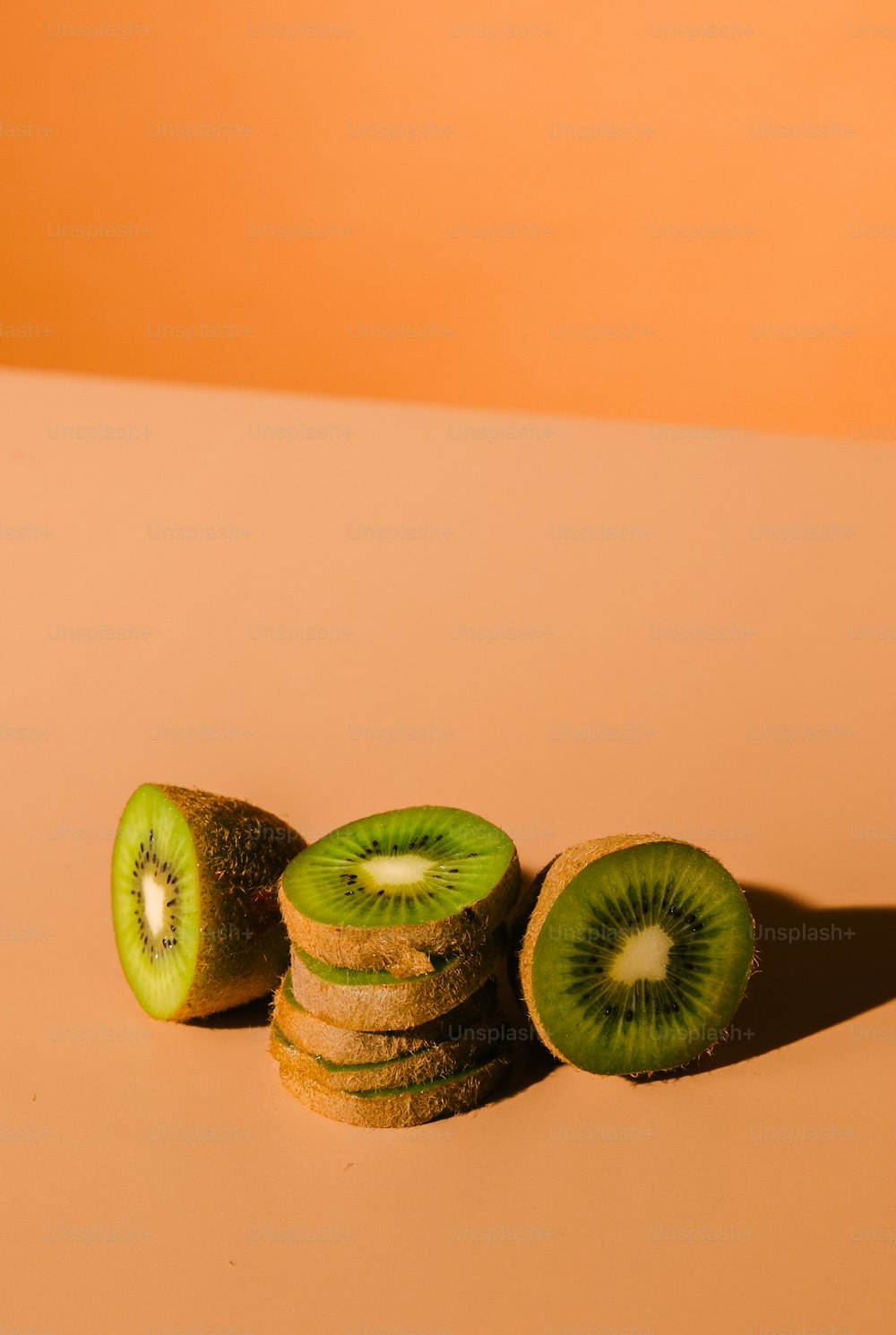 a couple of kiwi slices sitting on top of each other