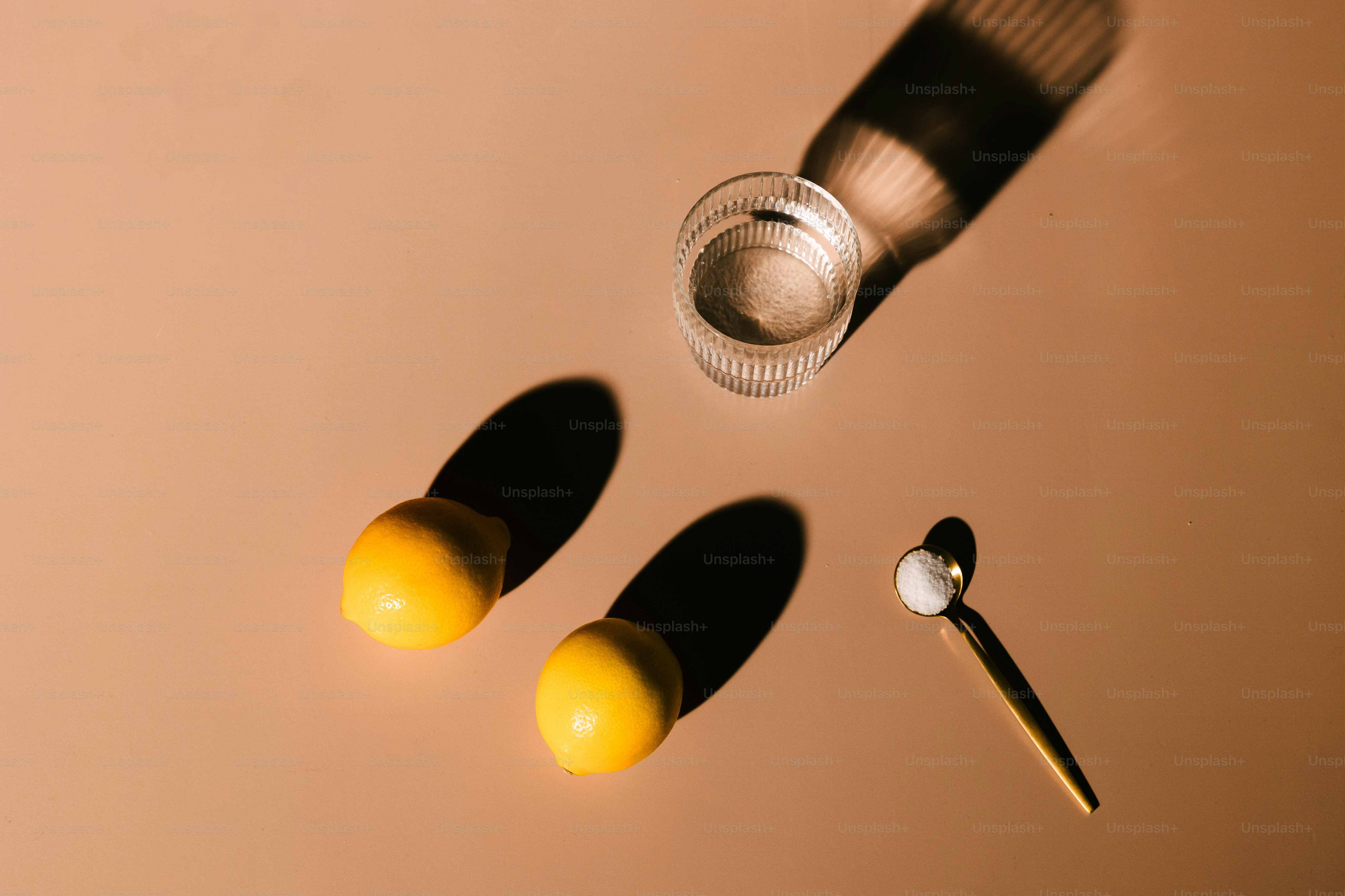 a couple of lemons sitting on top of a table