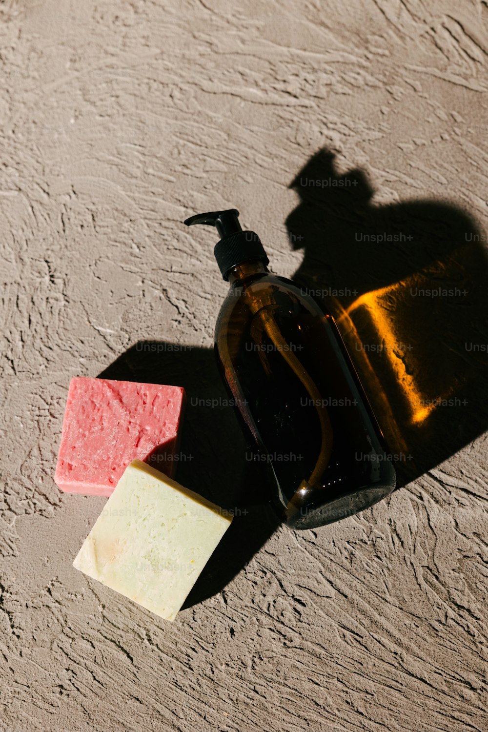 a bottle of soap next to a soap bar