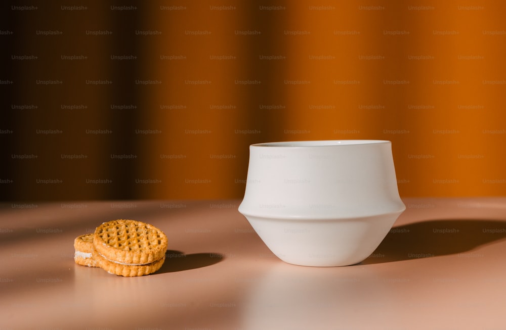 a bowl and a cookie on a table