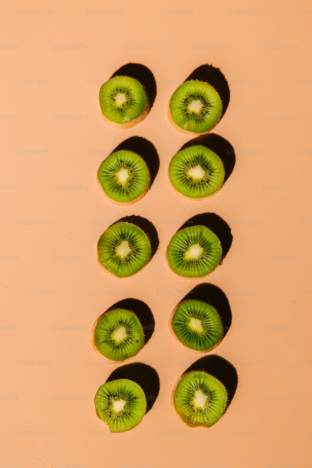 a group of kiwi slices sitting on top of a table