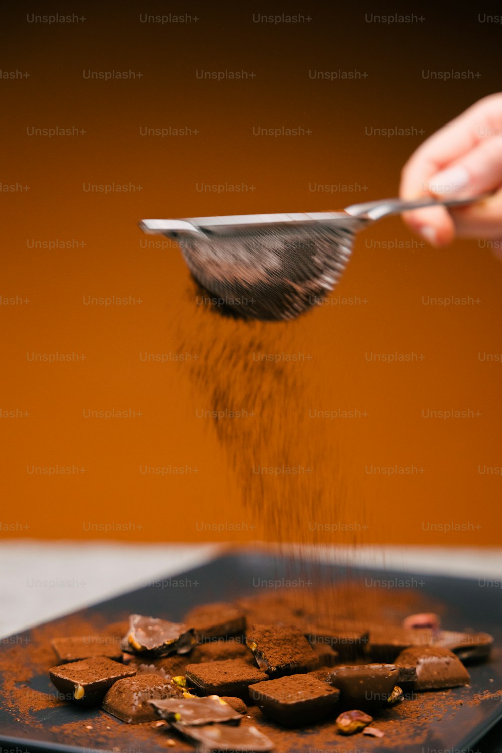 a person scooping some food out of a pan
