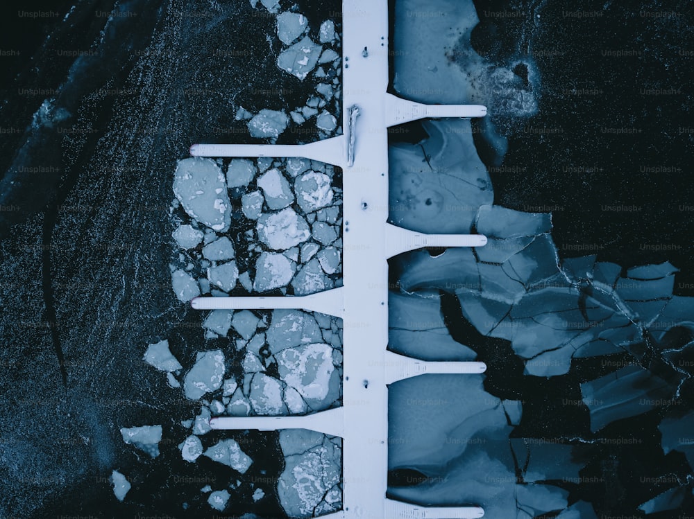 an aerial view of a snow covered dock