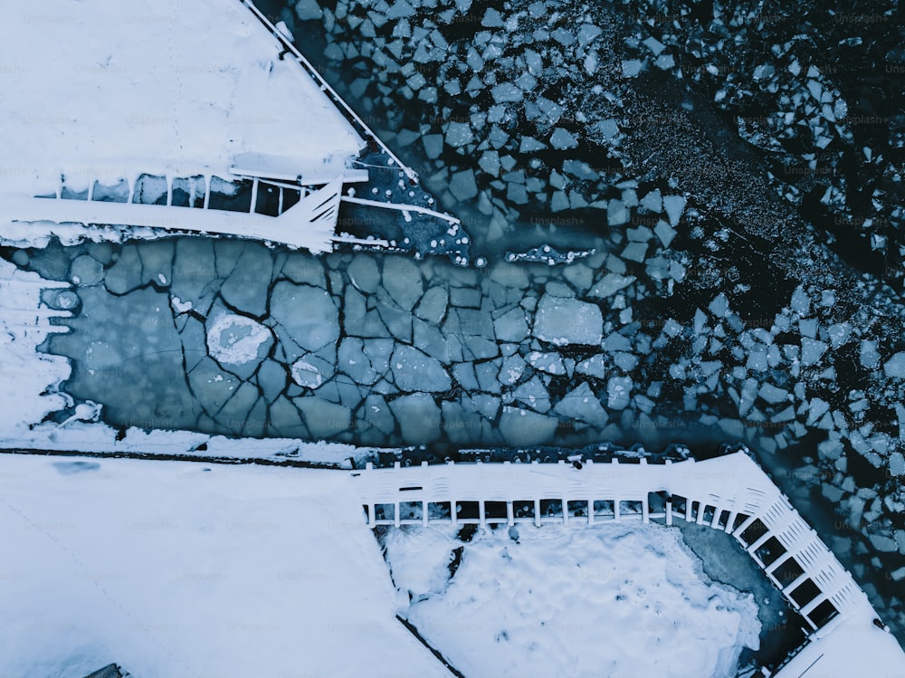 an aerial view of a building with ice on the ground