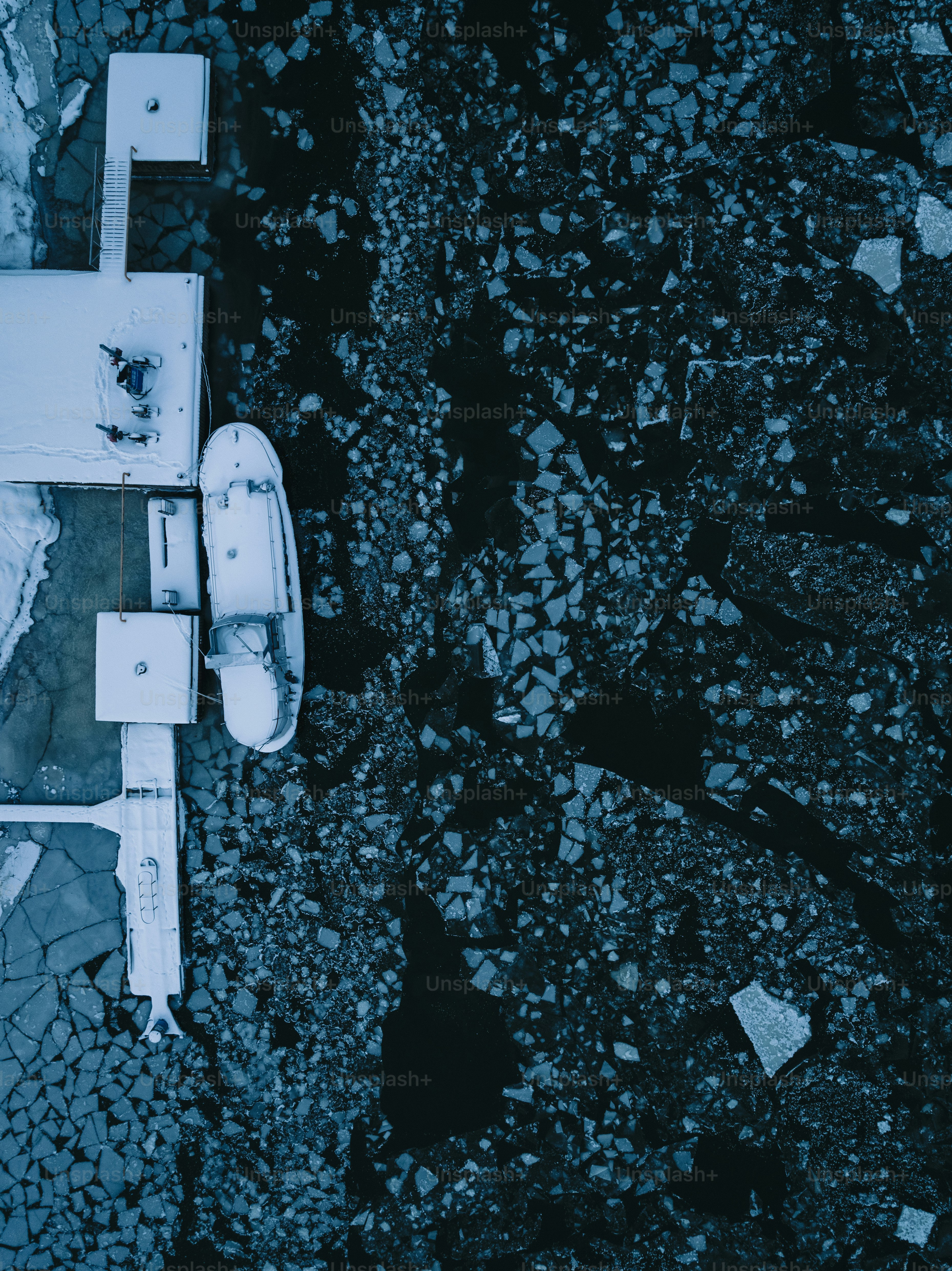 an aerial view of a boat in the water