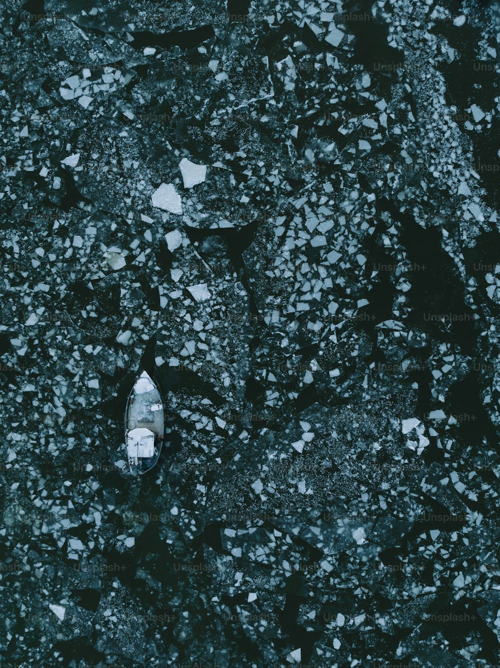 an aerial view of a white shoe on ice