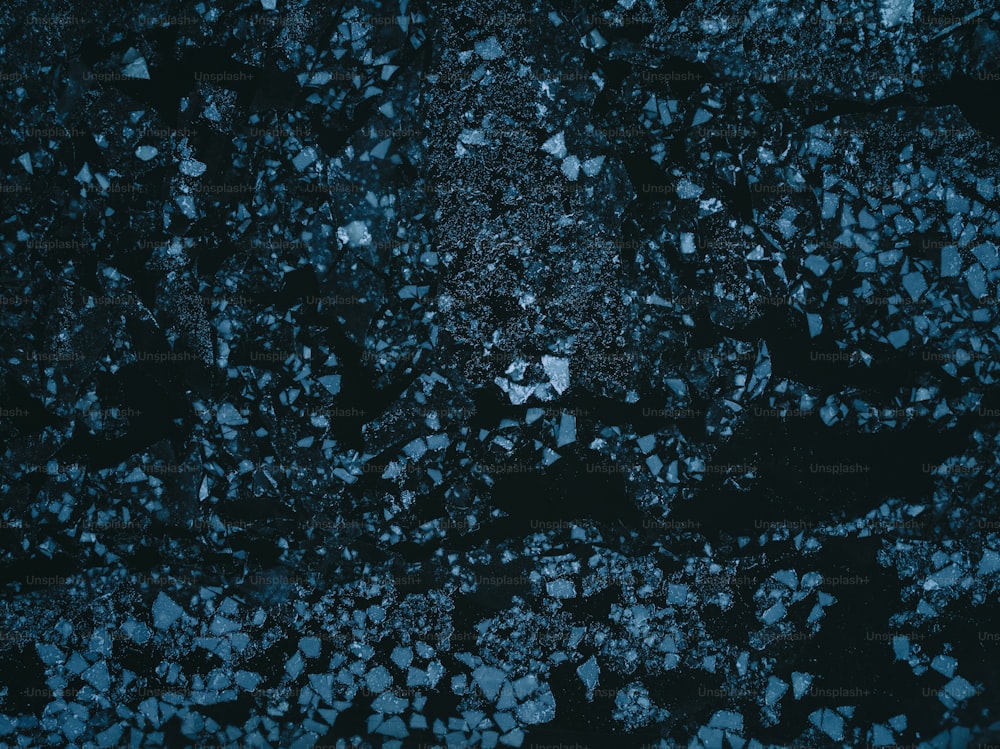 a close up of a black and blue surface