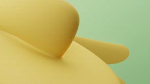 a close up of a yellow object on a green background