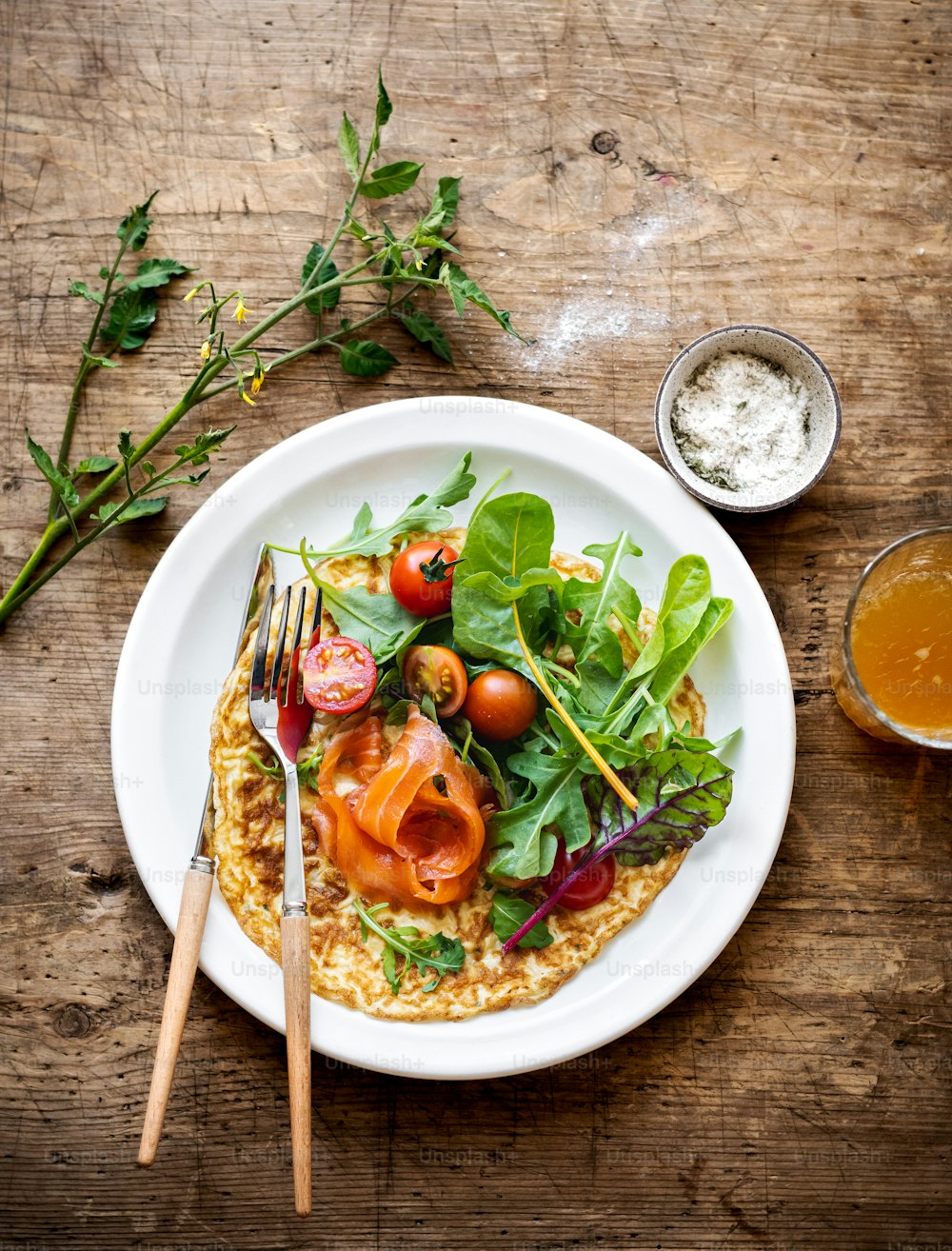 a plate of food on a wooden table