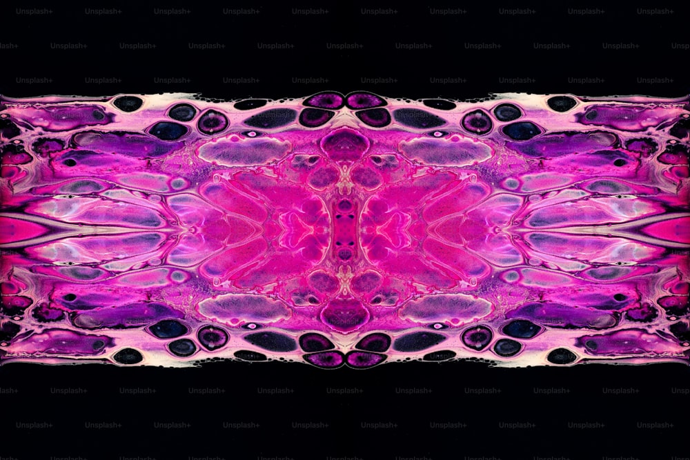 a pink and purple pattern on a black background
