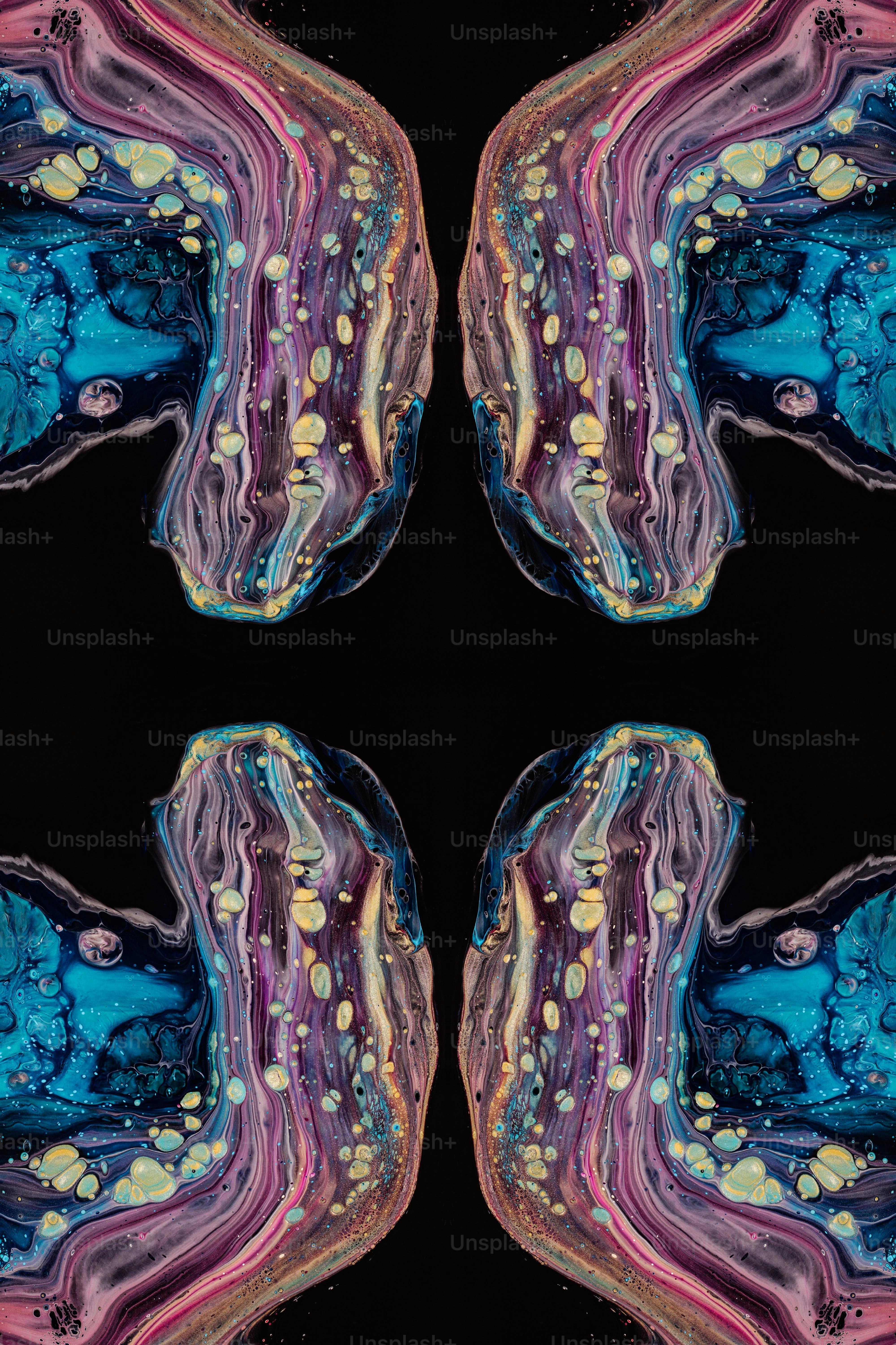 a picture of a black background with blue, pink, and yellow shapes