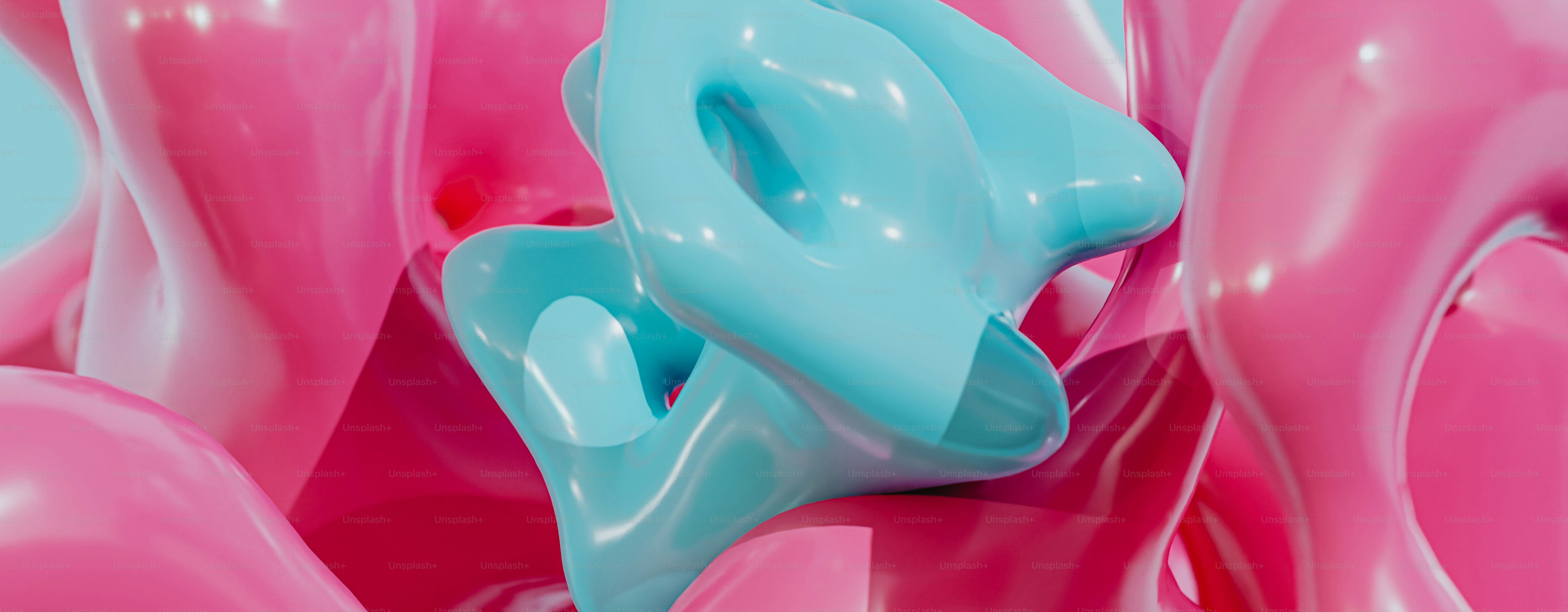 a close up of a pink and blue object