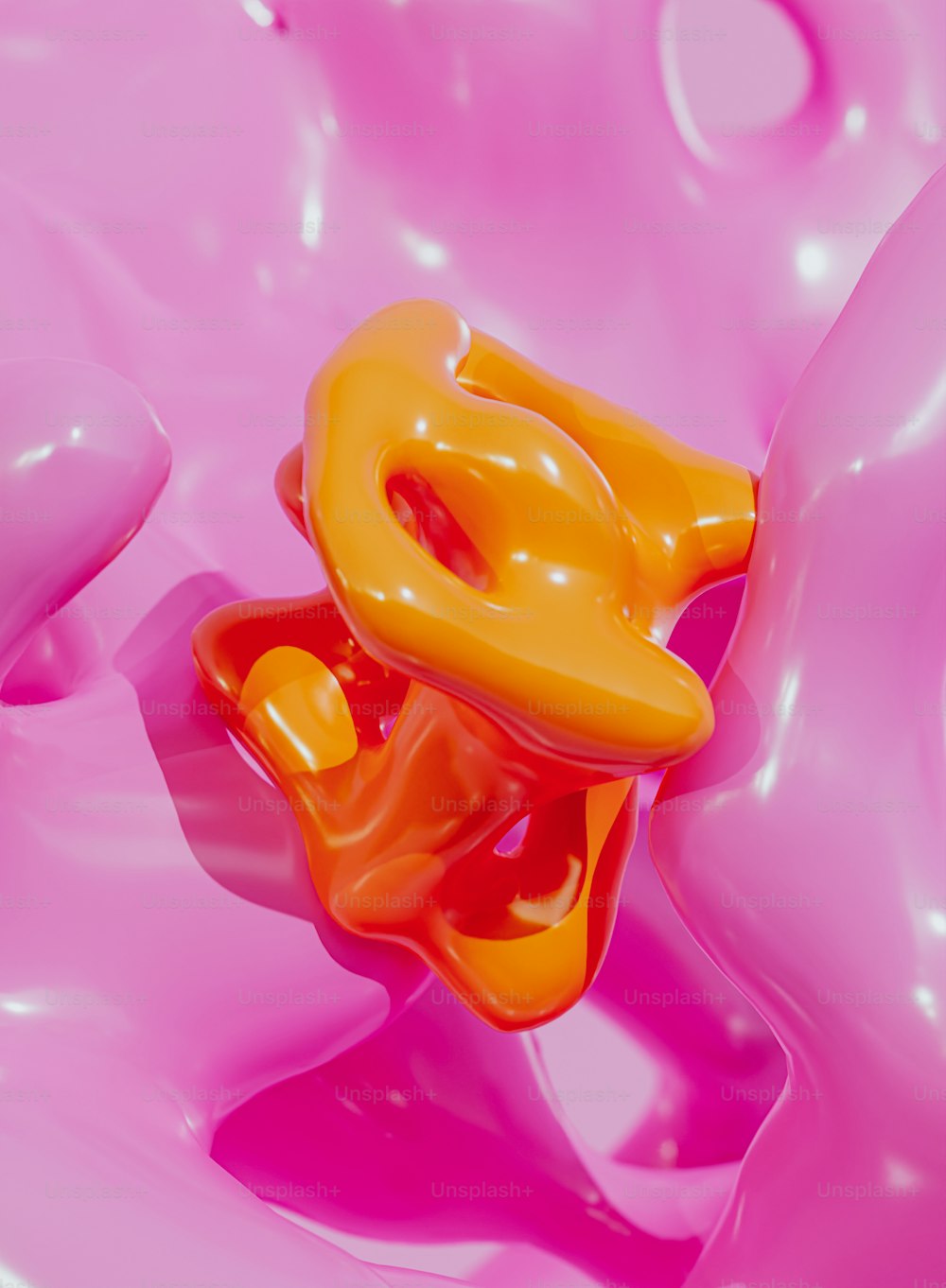 a close up of a pink and orange object