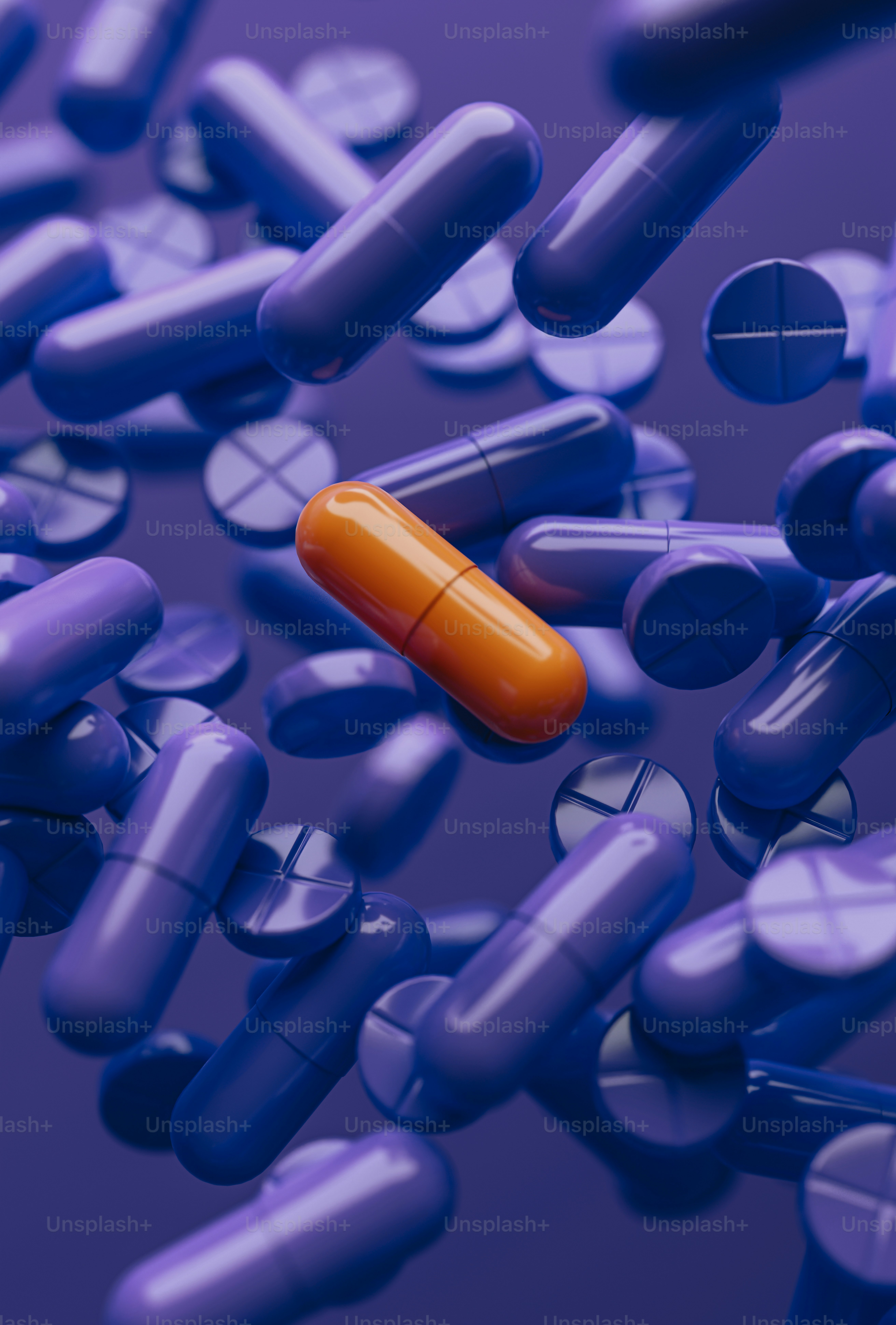 중간에 하나의 주황색 알약이 있는 알약 그룹