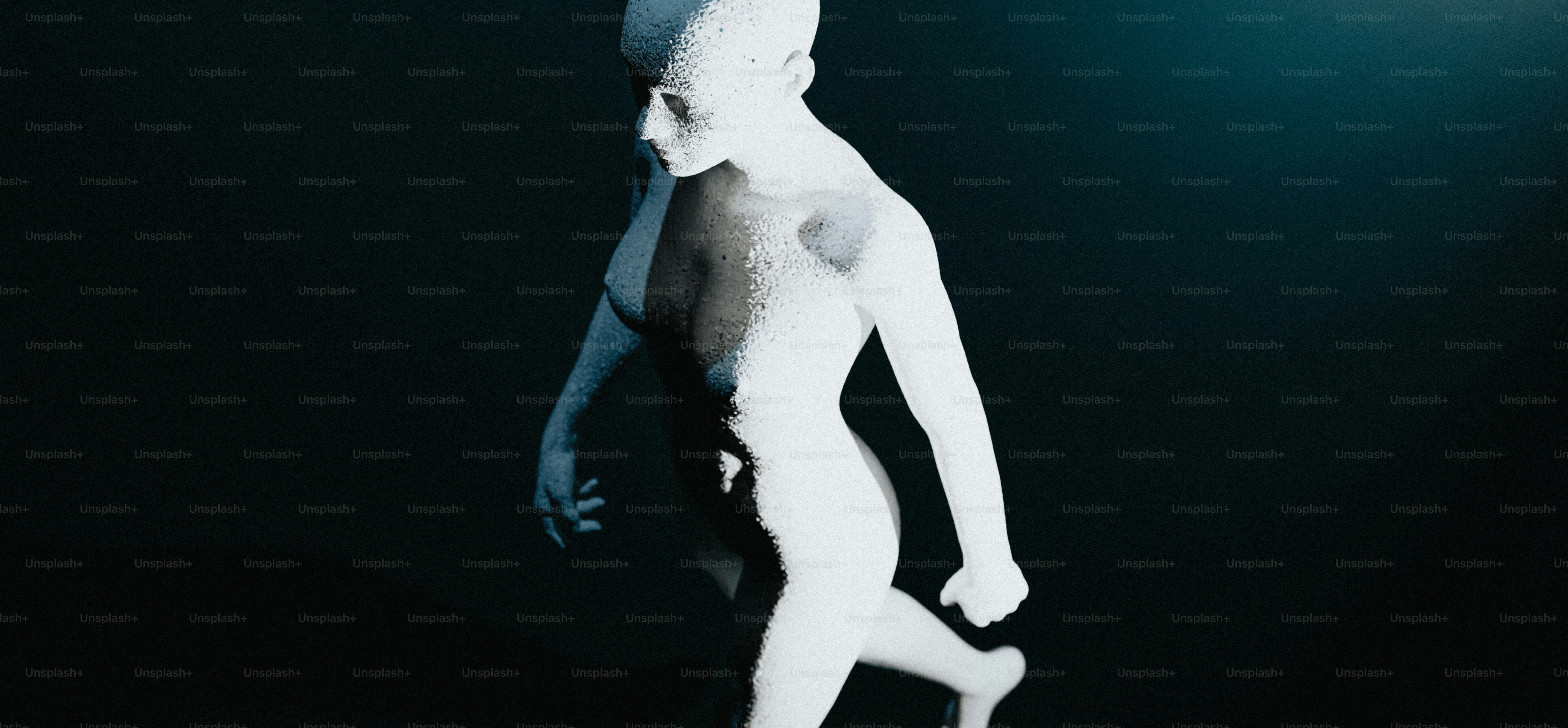a white statue of a person standing in the dark