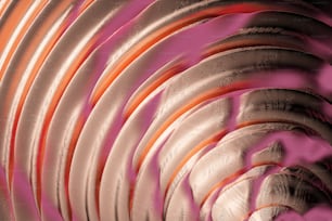 a close up of a circular object with a pink background