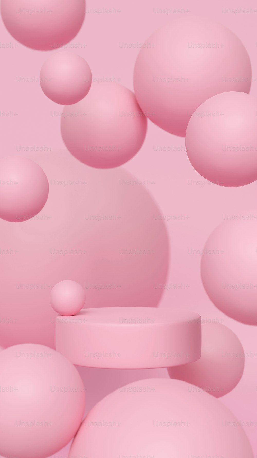 um monte de bolas cor-de-rosa flutuando no ar