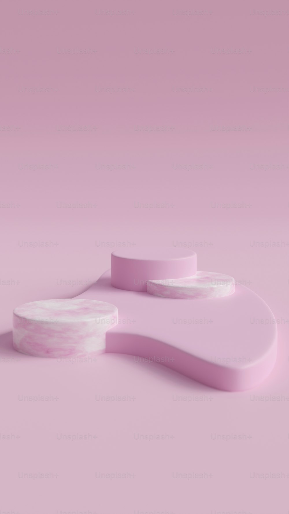 a pink and white object on a pink background