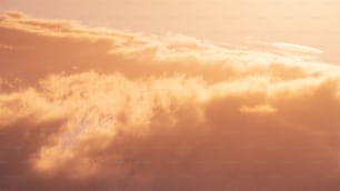 a plane flying in the sky with a lot of clouds