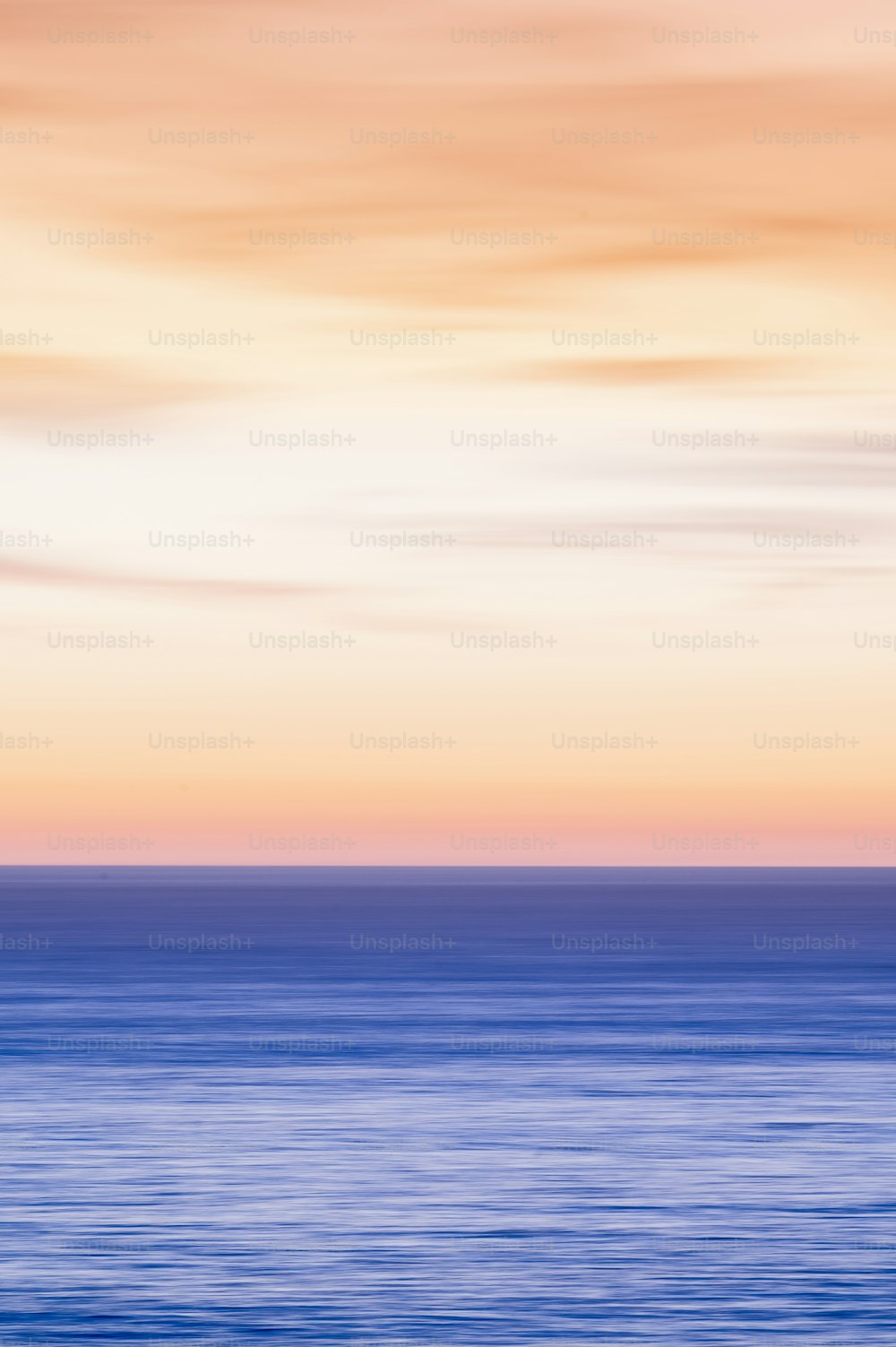 a large body of water sitting under a cloudy sky