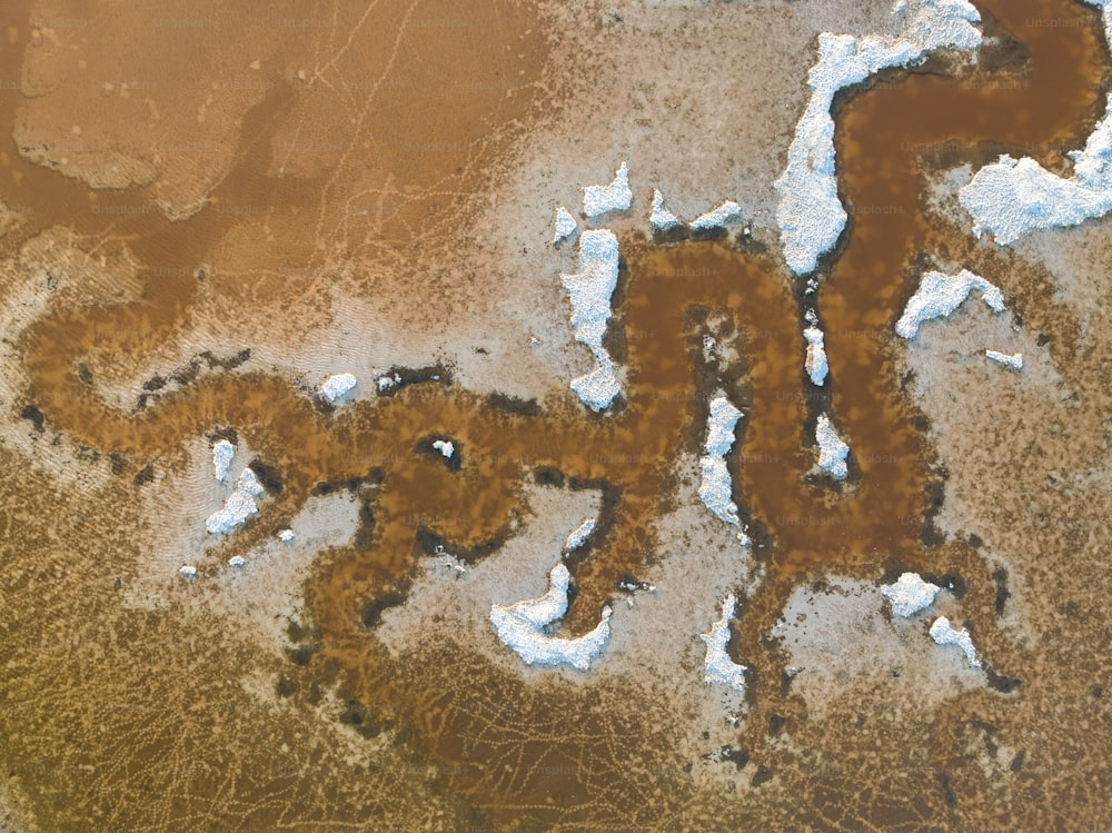 an aerial view of a brown and white area