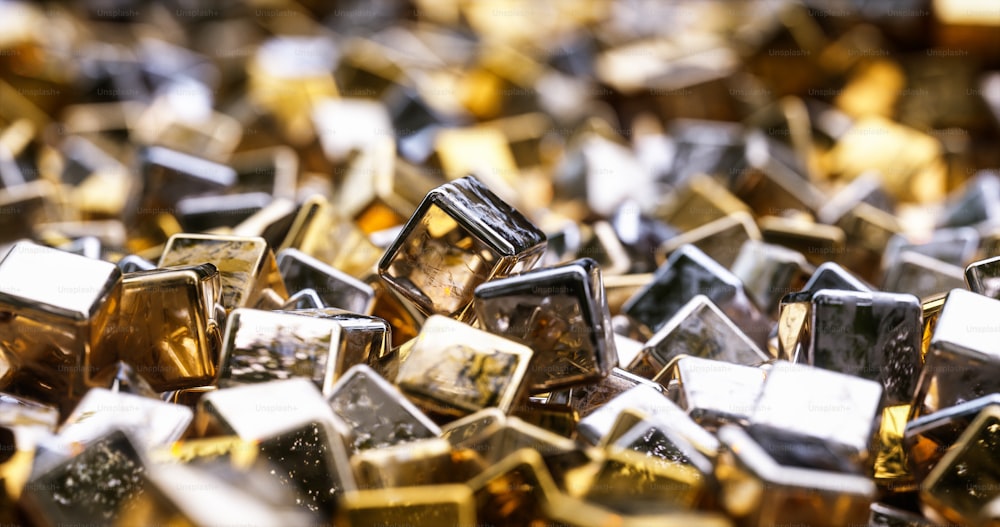 a pile of gold and silver cubes sitting on top of each other