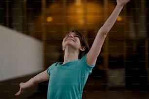 a woman is reaching up to catch a frisbee