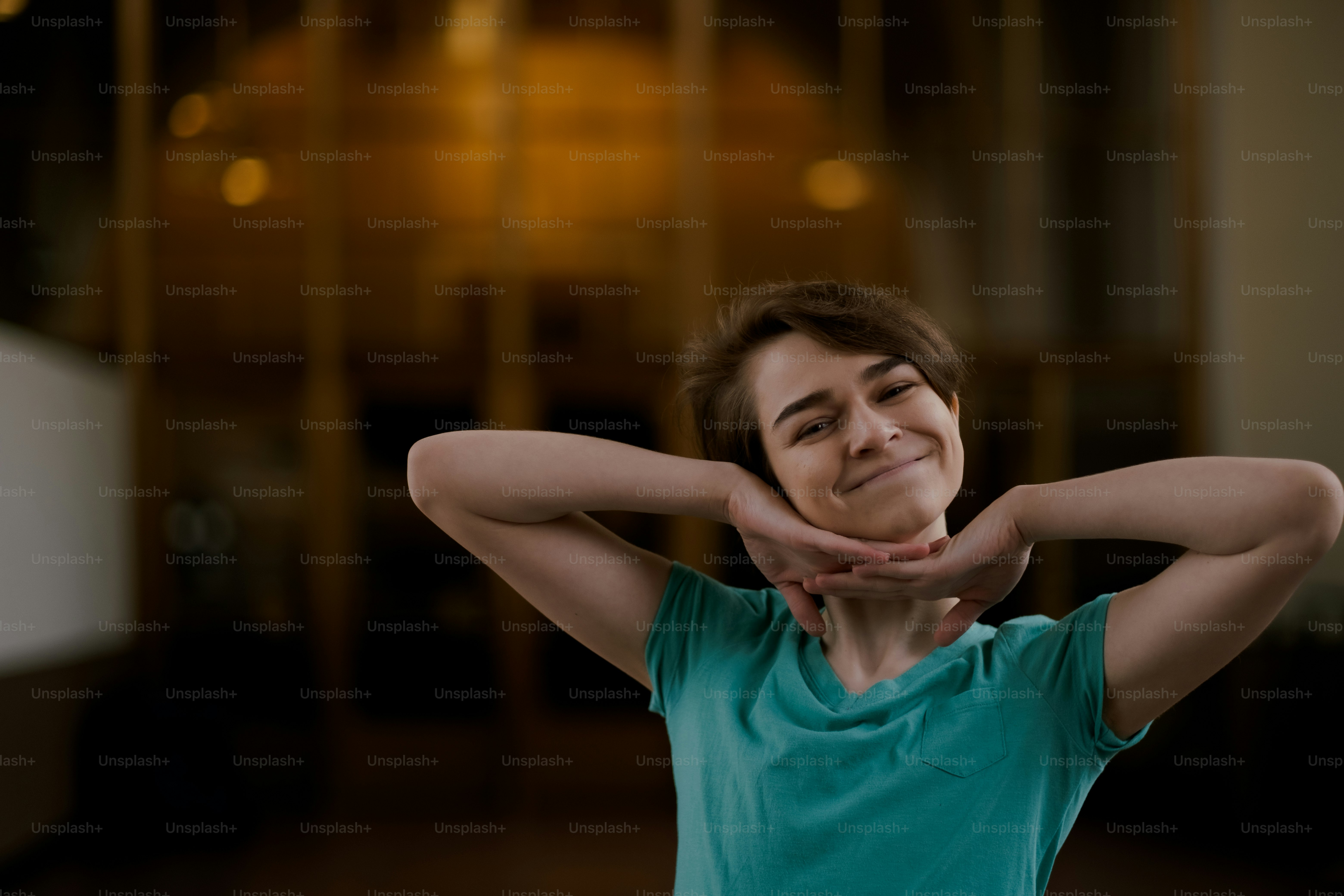 a woman with her hands behind her head