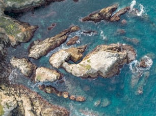 a bird's eye view of some rocks and water