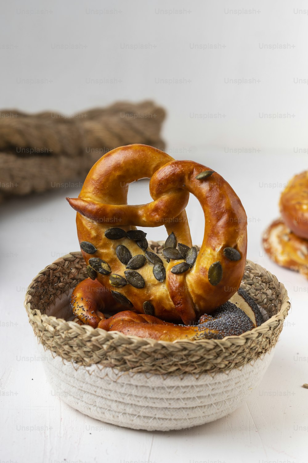 a bowl of food with a pretzel on top of it