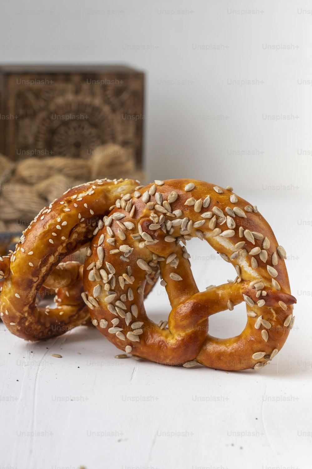 a couple of pretzels with sesame seeds on them