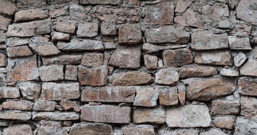 a stone wall made of small rocks