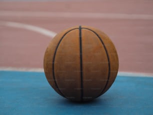 a close up of a basketball on a court