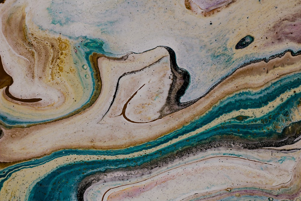um close up de uma superfície marmorizada com cores diferentes