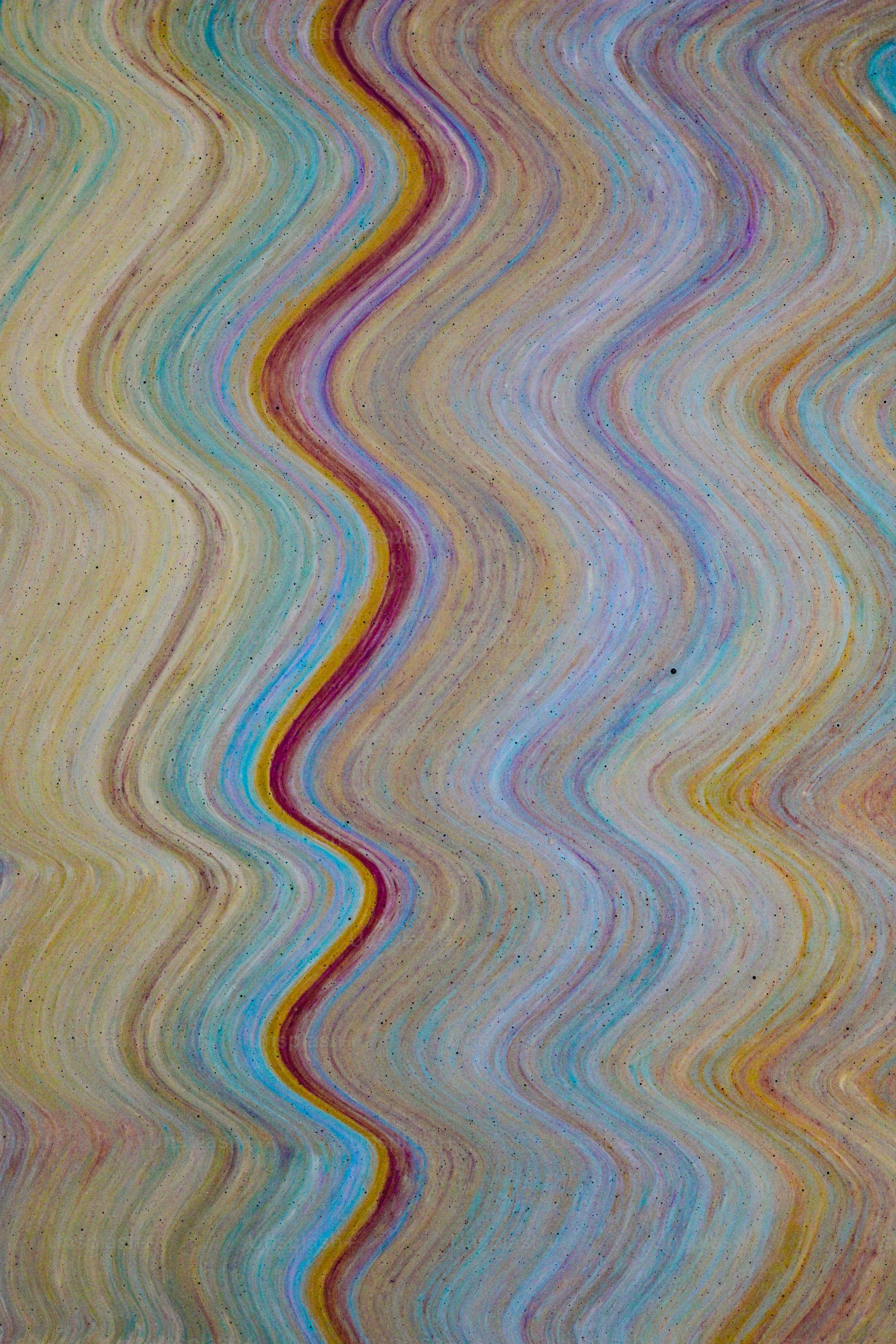 a multicolored wave pattern is shown in this image