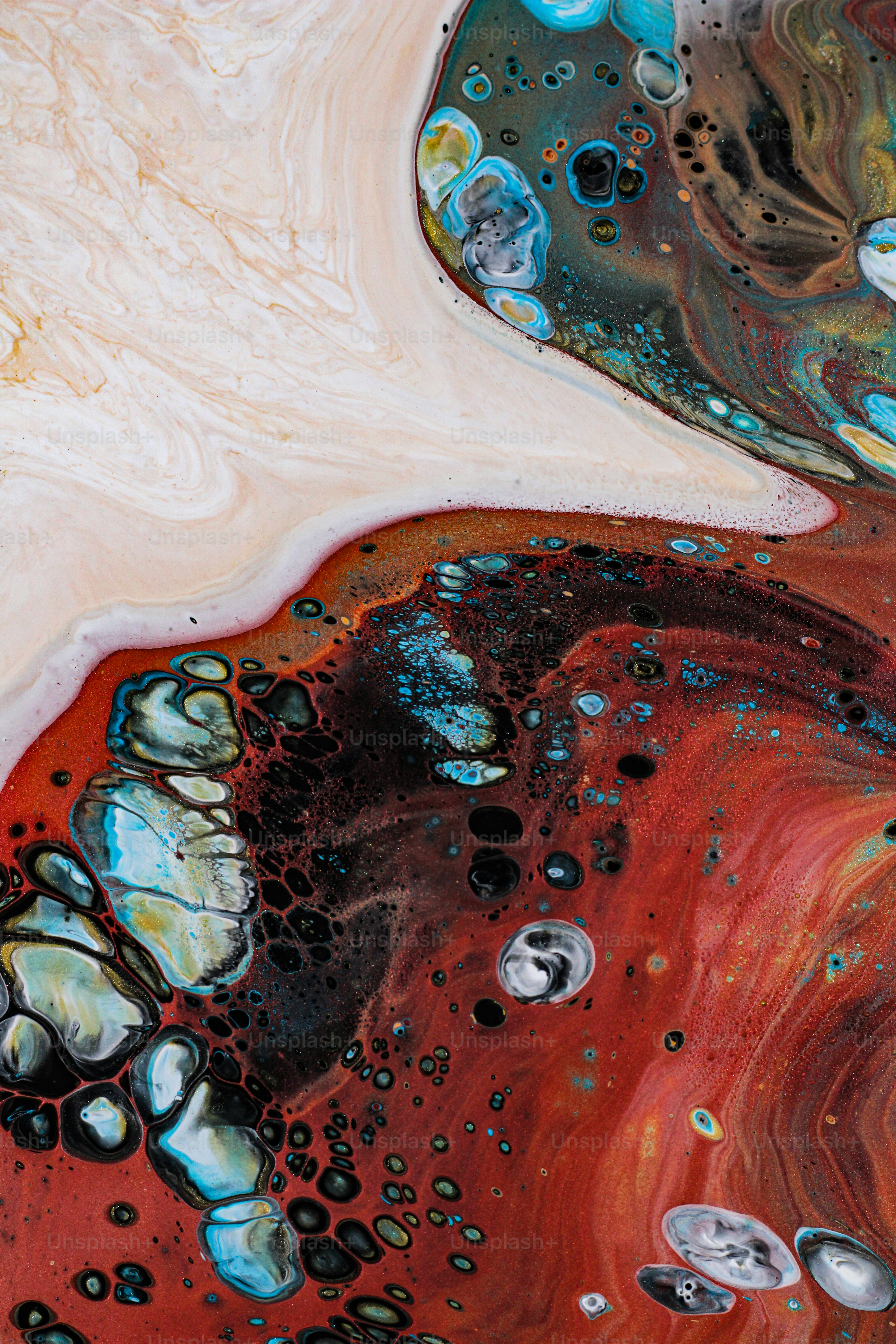 a close up of a red and blue fluid painting
