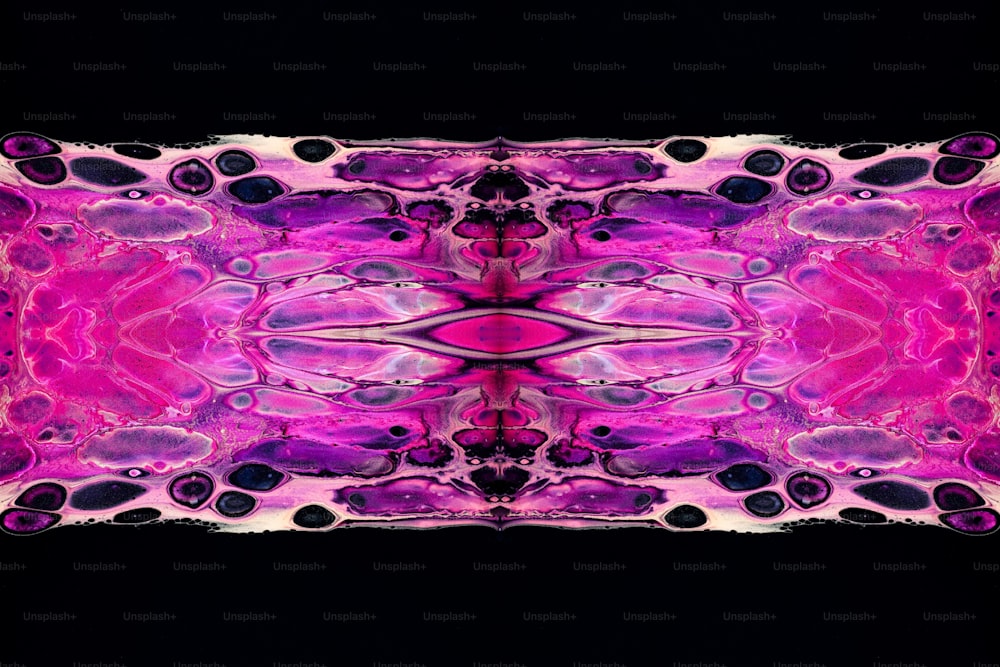 a pink and purple pattern on a black background