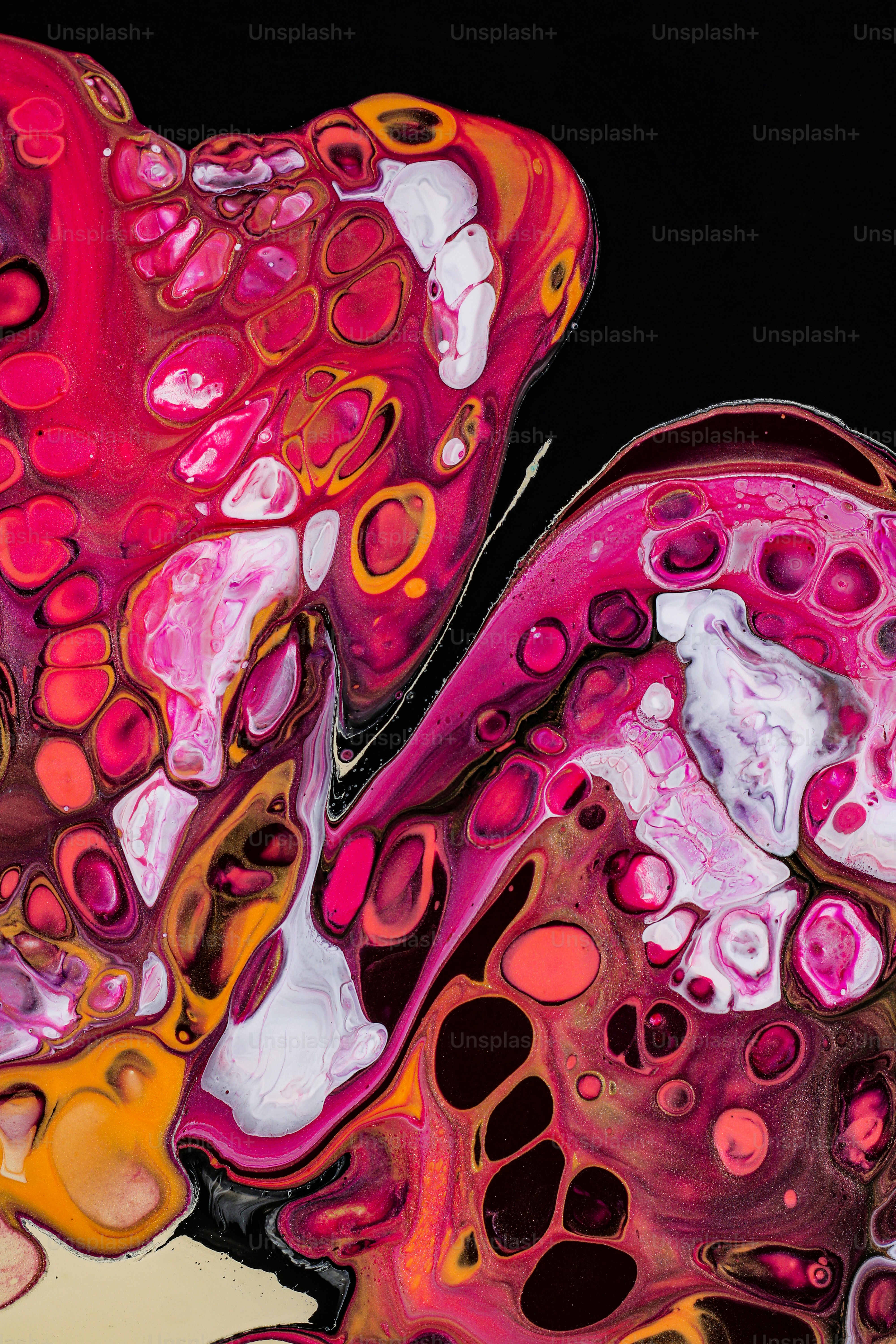 a close up of an abstract painting with pink and yellow colors