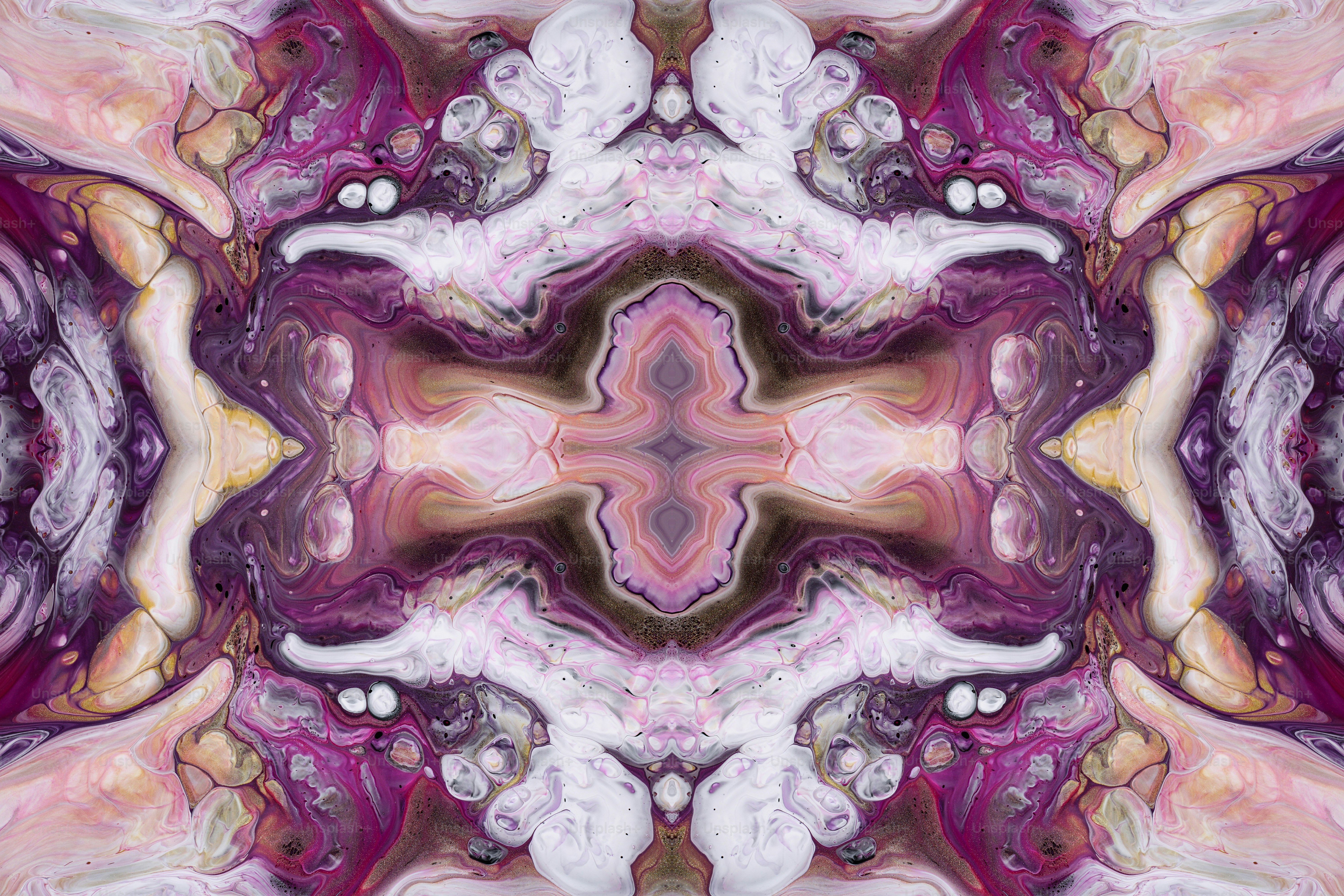 an abstract image of a pink and purple flower