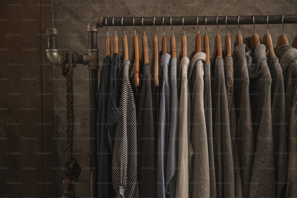 a rack of clothes hanging on a wall